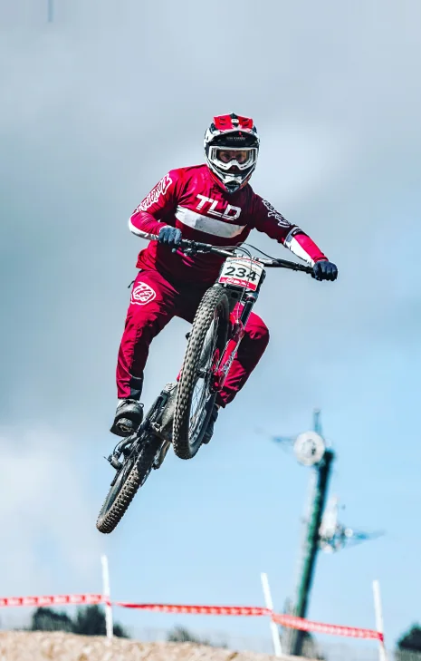 Whipping the bike over a race jump