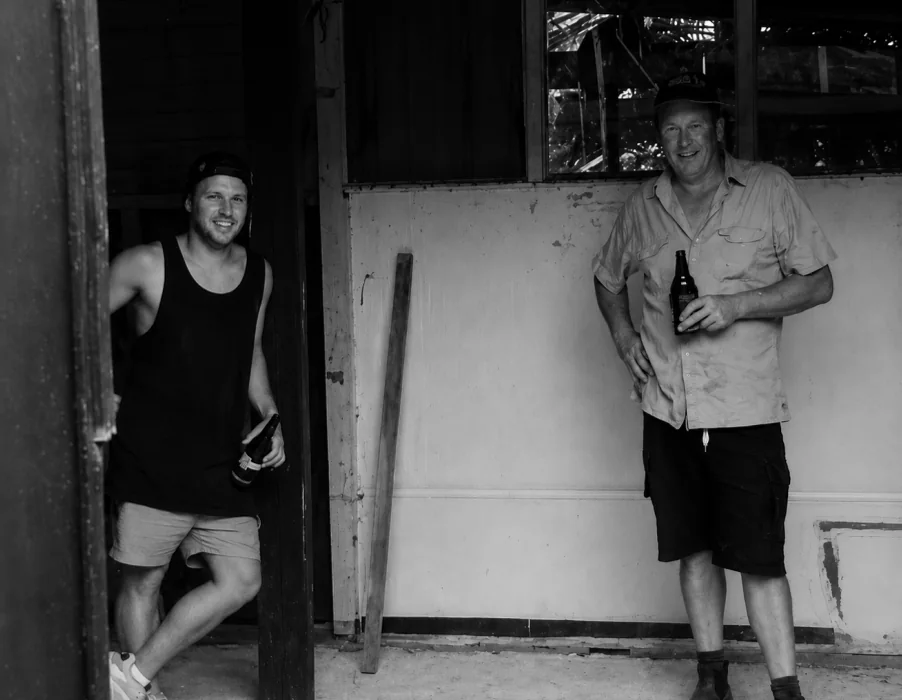Jason and his stepfather outside the workshop