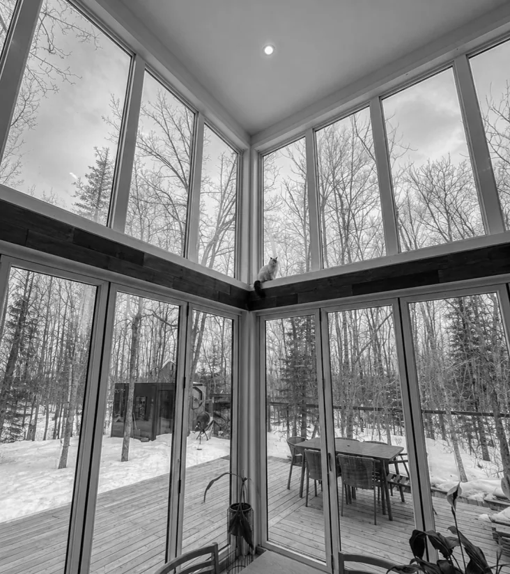 The double-height corner windows in winter