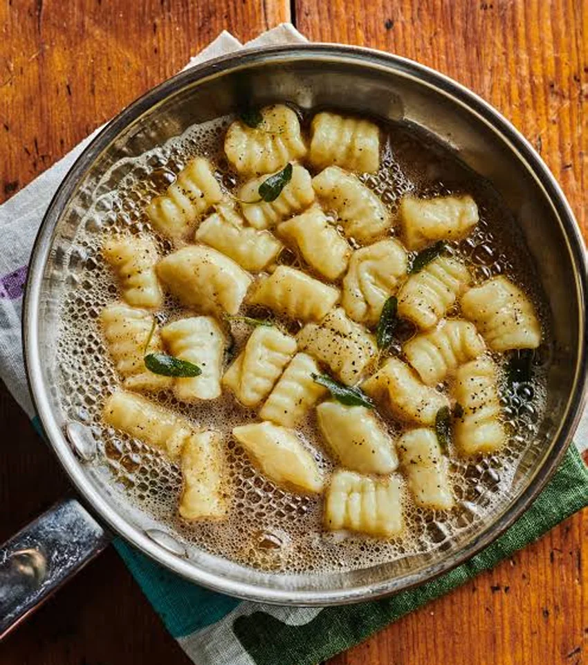 Hand made gnocchi with sage butter in a pan