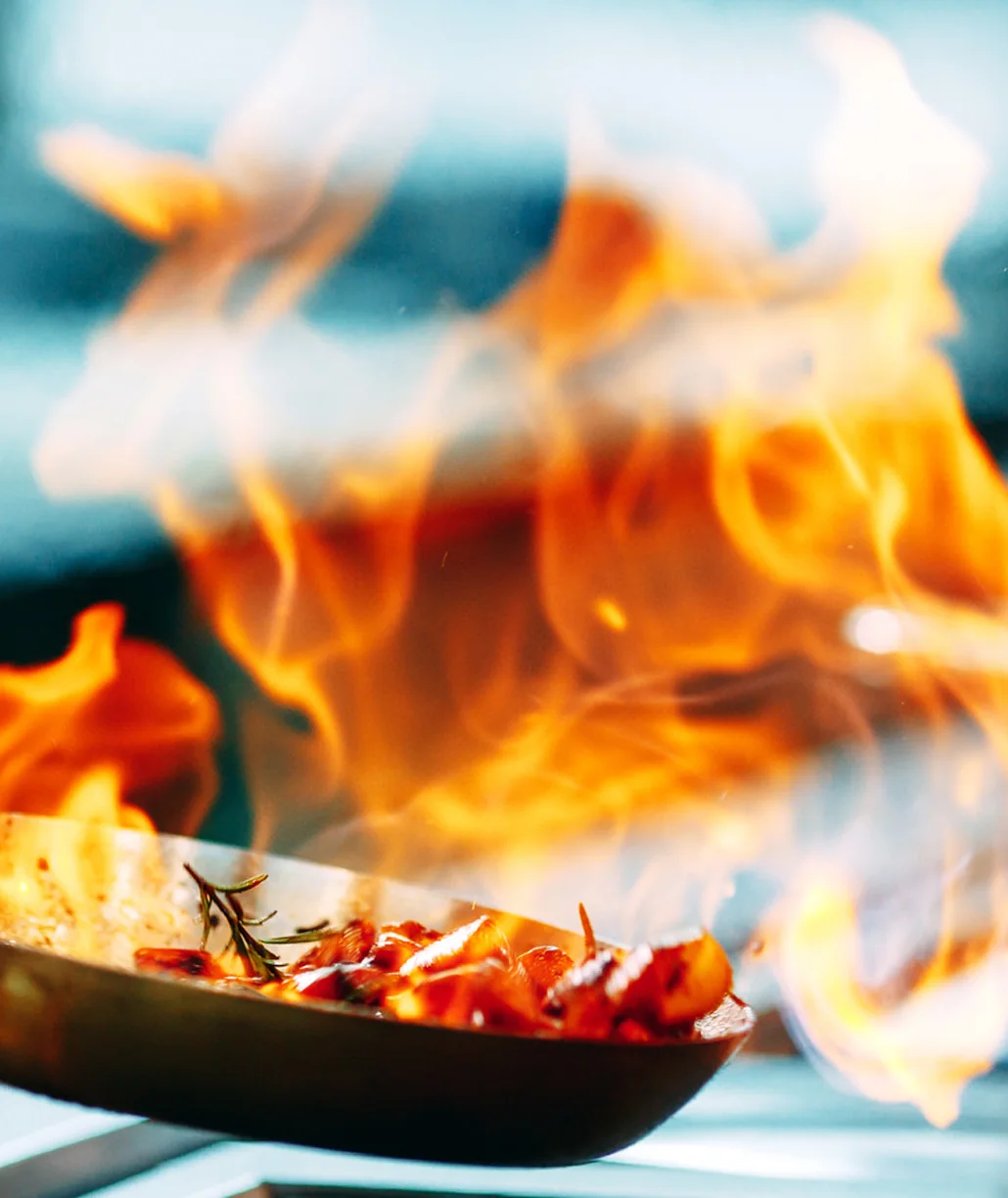 Scallops flamed in a pan