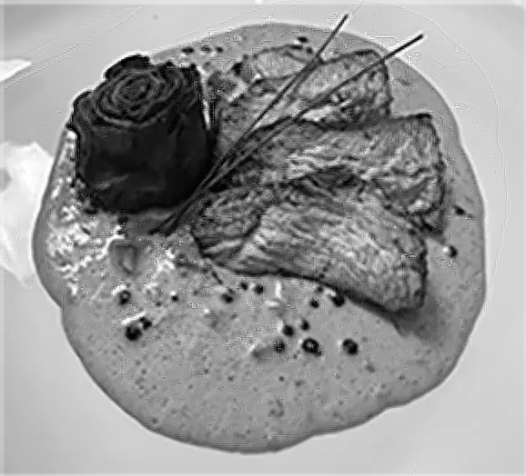 Prime filet with creamy peppercorn sauce and a beetroot rose