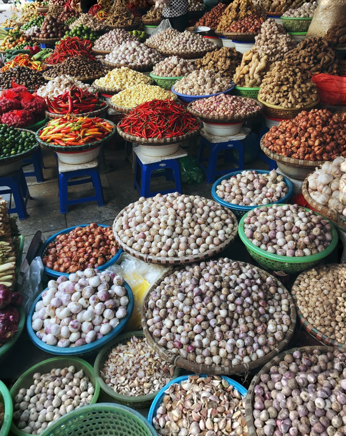 Baskets of produce at a Vietnamese spice market