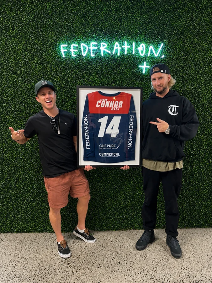 At Federation HQ with a framed number 14 jersey